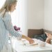 A warm family moment with a mother and daughter sharing breakfast at home.